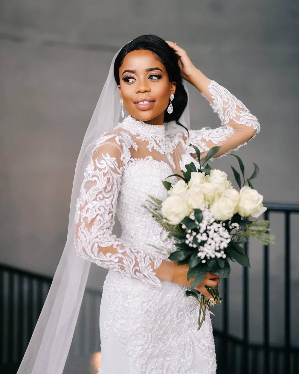 Saarahjasmin Couture bride in a hand-beaded lace gown and cathedral veil