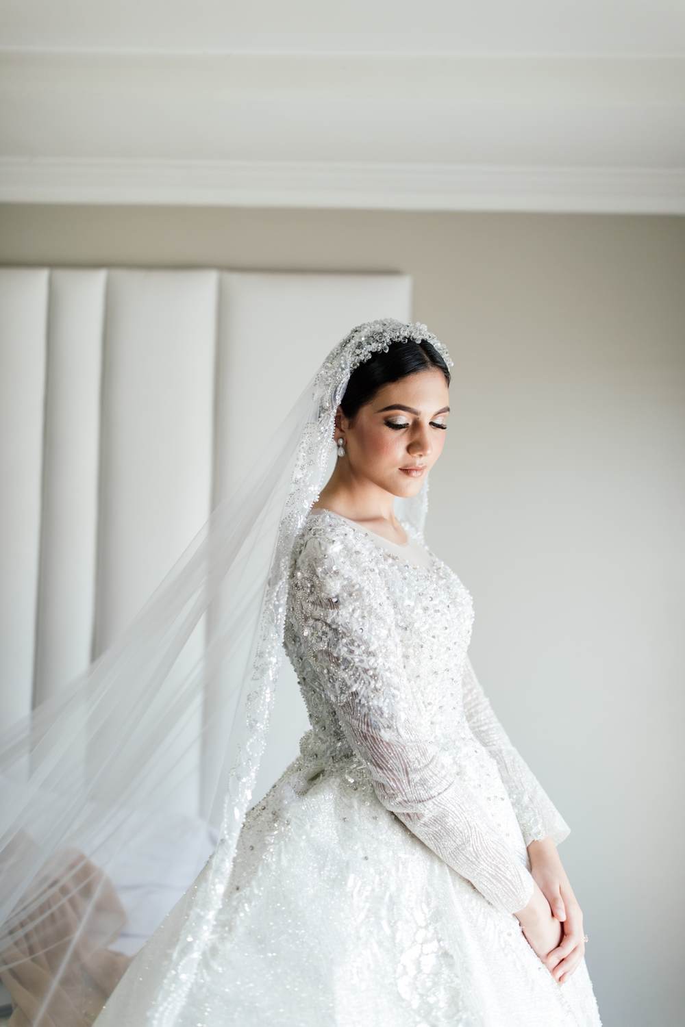 Bride in a fully beaded modest wedding gown with veil, Cape Town